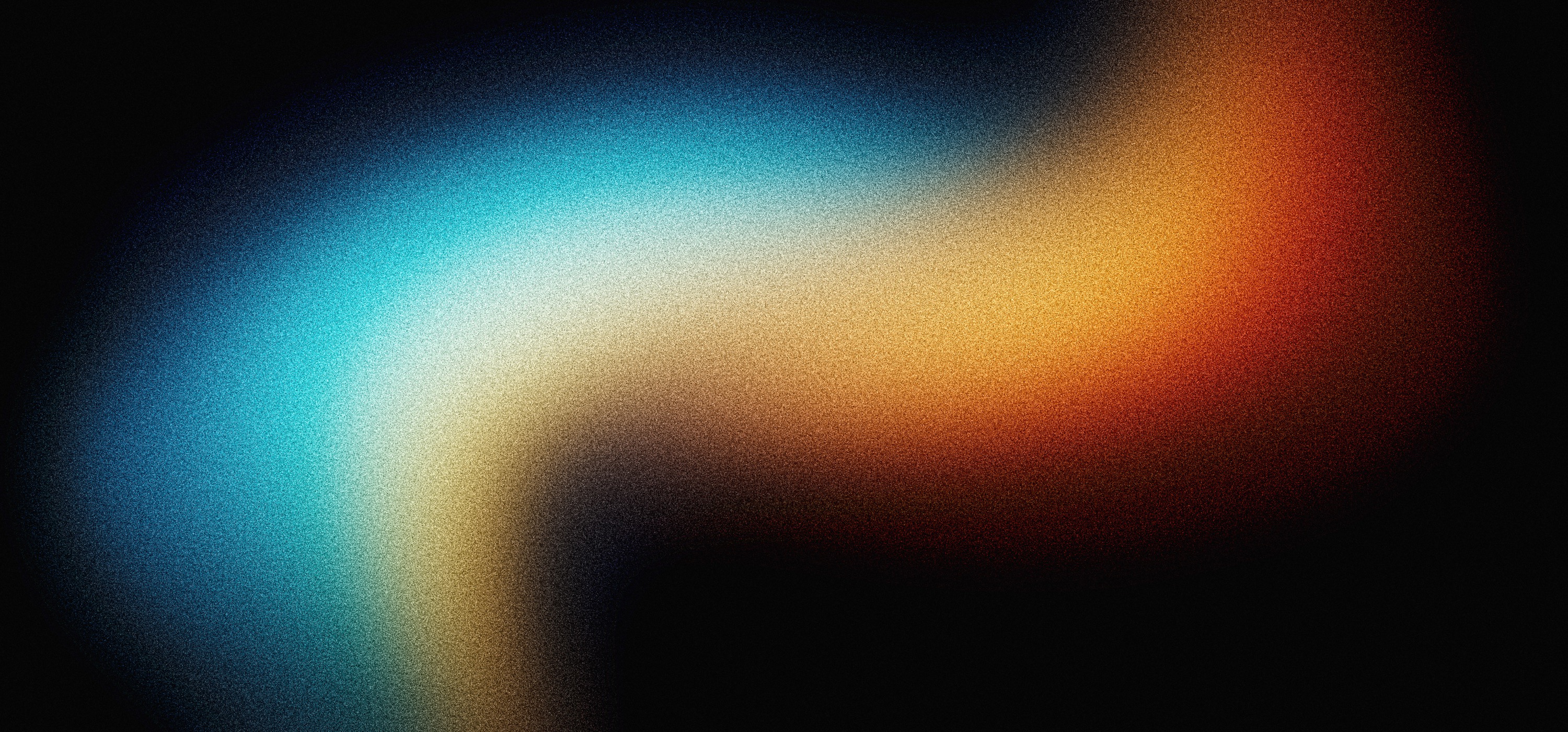 Blurred blue, orange, and black light texture used as an abstract creative background.